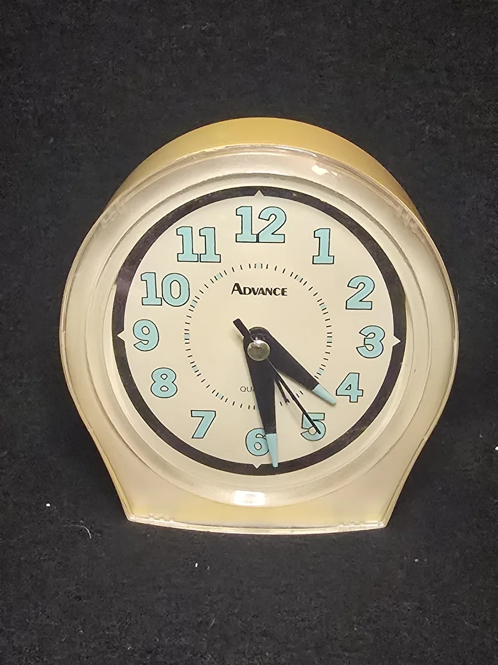 Advance Yellow Clock with Aqua Numerals